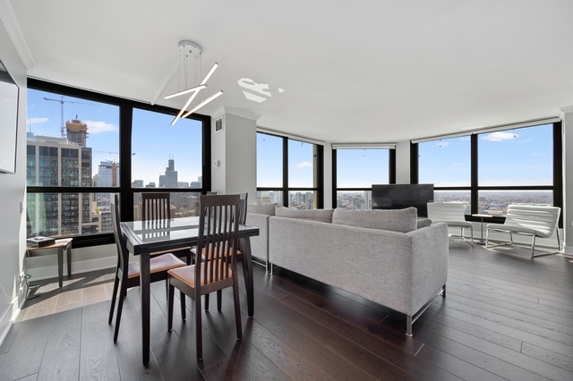 Undisclosed Address Chicago, IL 60610 - Photo 3 of 8 a living room with furniture wooden floor and a table