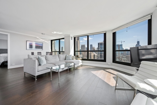 Undisclosed Address Chicago, IL 60610 - Photo 4 of 8 a living room with furniture large window and wooden floor