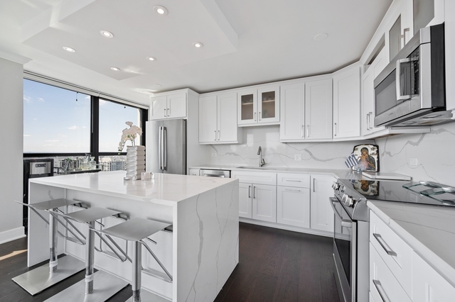 Undisclosed Address Chicago, IL 60610 - Photo 6 of 8 a kitchen with stainless steel appliances kitchen island granite countertop a sink and cabinets