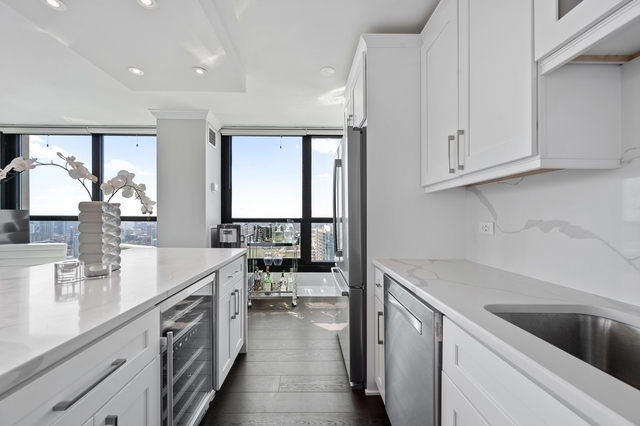 Undisclosed Address Chicago, IL 60610 - Photo 8 of 8 a kitchen with a sink stove and cabinets