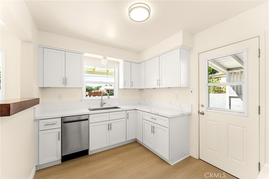 1253 Cottonwood Road Banning, CA 92220 - Photo 22 of 22 a kitchen with a sink cabinets and window