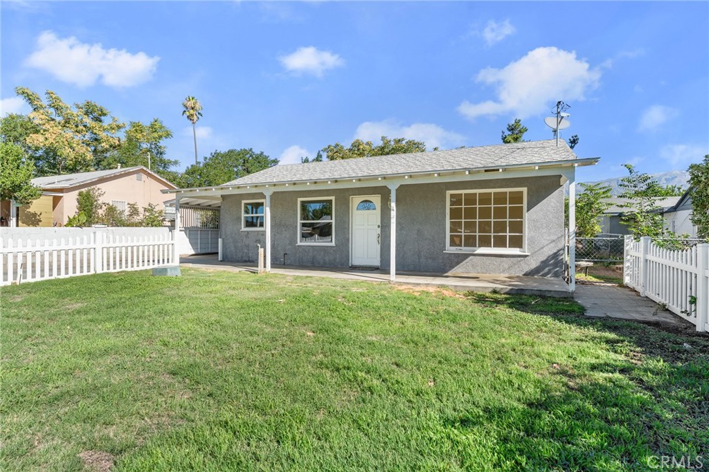 1253 Cottonwood Road Banning, CA 92220 - Photo 3 of 22 a front view of a house with a yard
