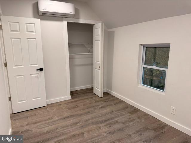 42 North Cove Road, Unit 4 Merchantville, NJ 08109 - Photo 6 of 8 an empty room with wooden floor and windows