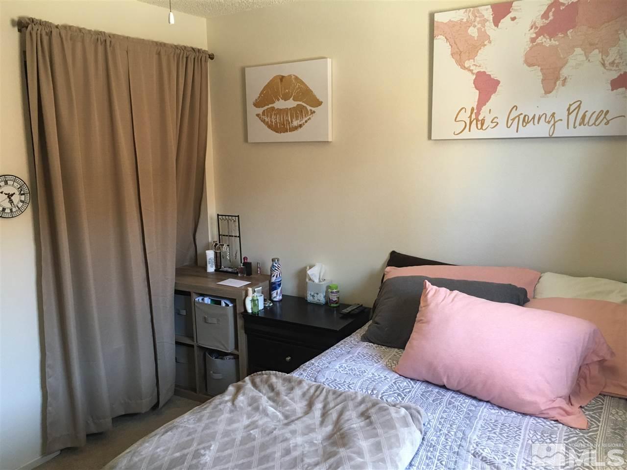 6501 Flower Street Reno, NV 89506 - Photo 14 of 19 a bedroom with a bed and bathroom