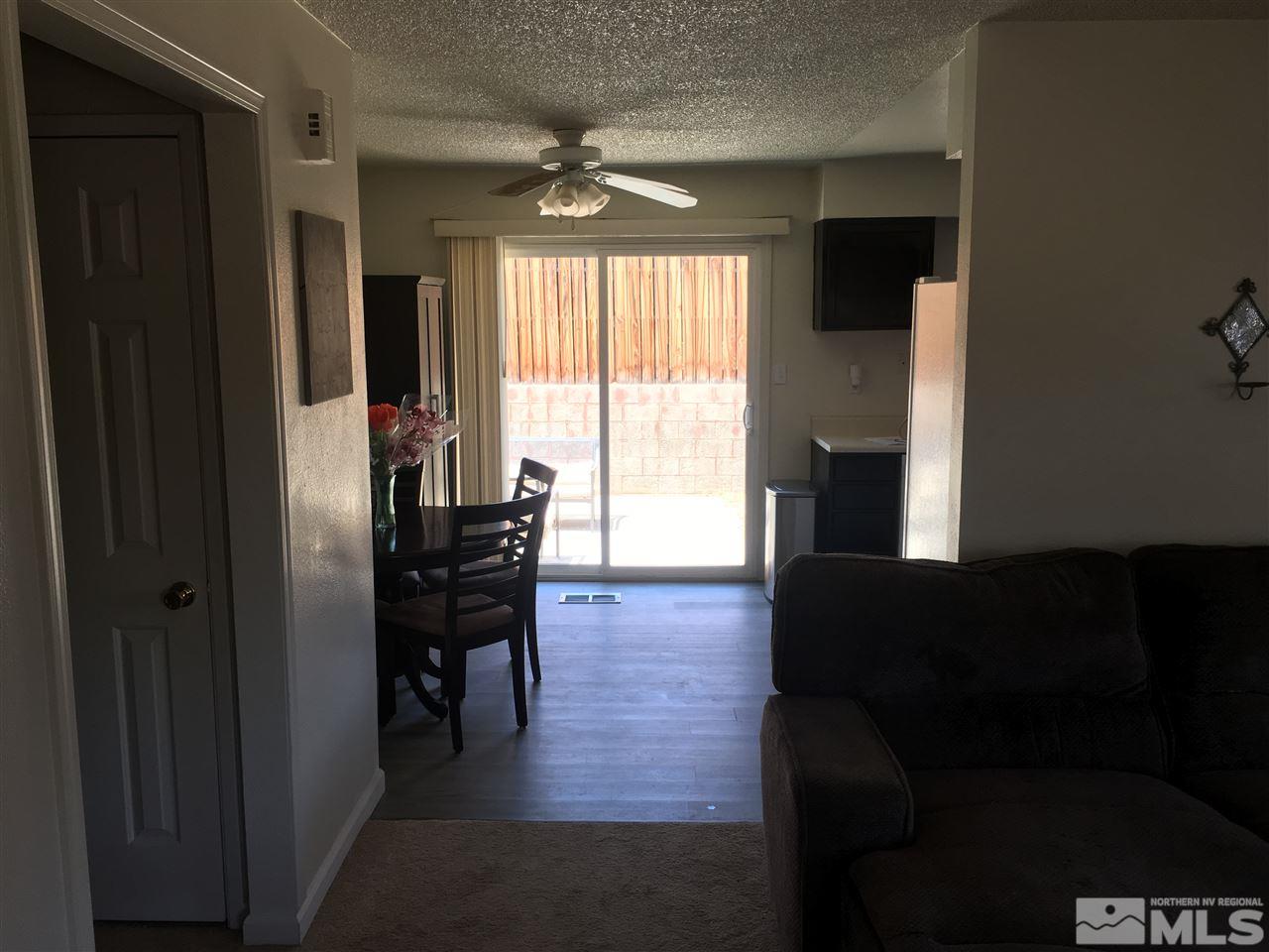 6501 Flower Street Reno, NV 89506 - Photo 3 of 19 a living room with furniture wooden floor and a window