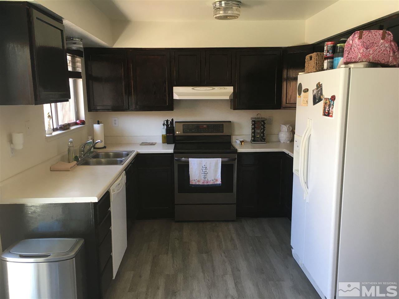6501 Flower Street Reno, NV 89506 - Photo 5 of 19 a kitchen with a sink and a refrigerator