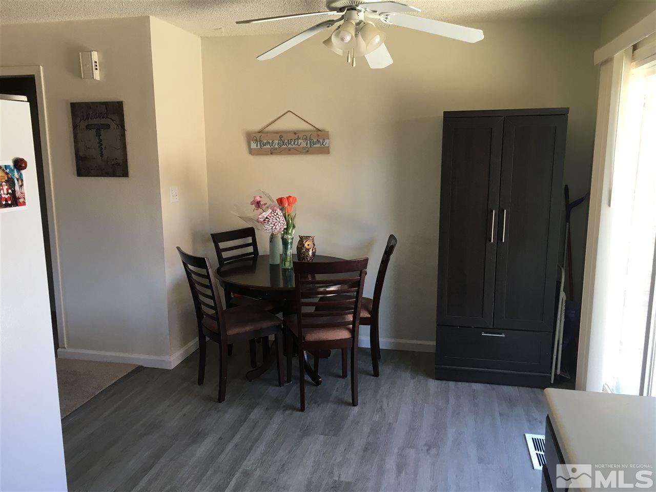 6501 Flower Street Reno, NV 89506 - Photo 6 of 19 a view of a dining room with furniture and wooden floor