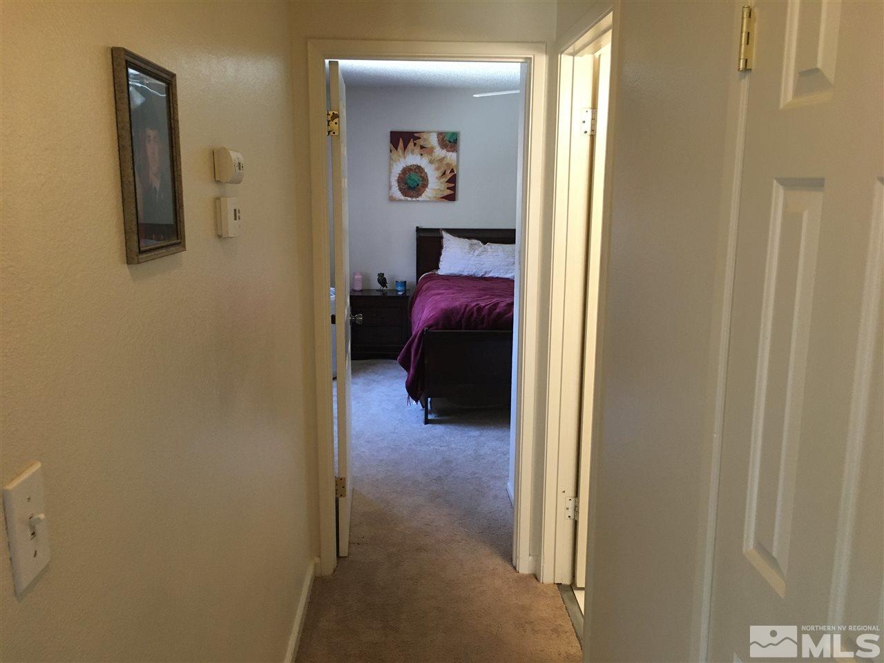 6501 Flower Street Reno, NV 89506 - Photo 8 of 19 a view of a hallway with closet and couch