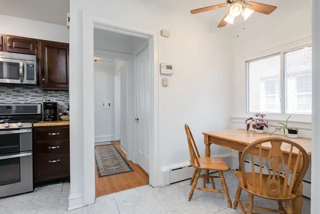 a view of a dining room with furniture and chandelier