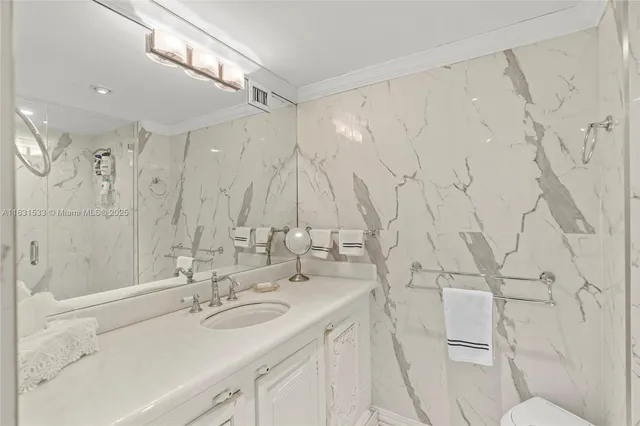 a view of storage and utility room with washer and dryer