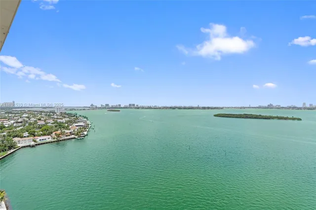 a view of a balcony dining table and chairs
