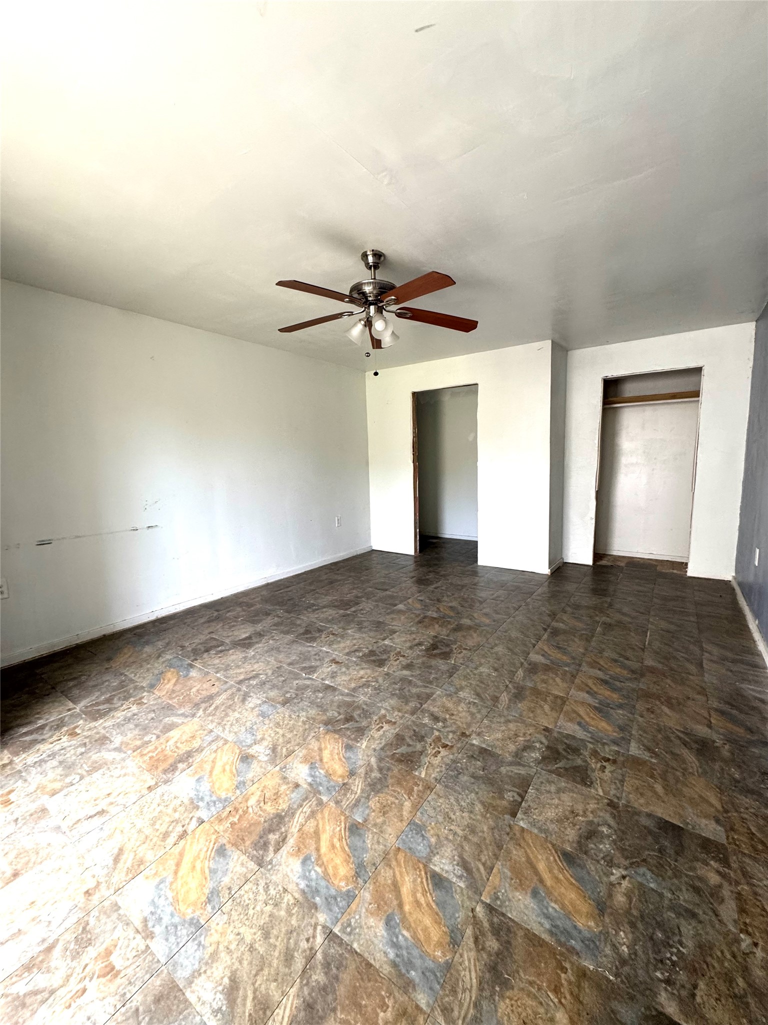 1810 Connorvale Road Houston, TX 77039 - Photo 22 of 23 a view of a big room with chandelier fan and windows
