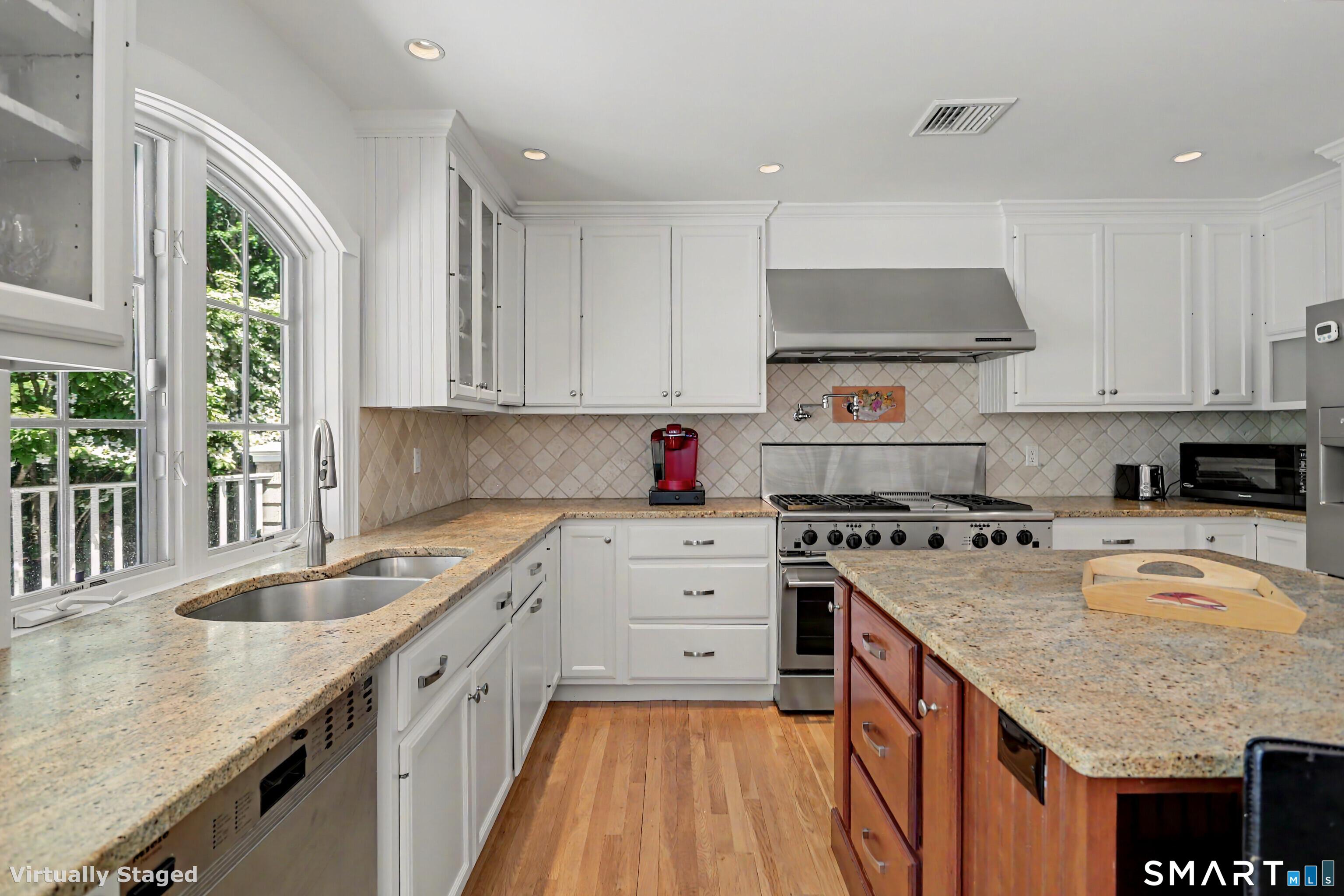 186 Compo Road South Westport, CT 06880 - Photo 7 of 40 The well outfitted Kitchen has freshly paiting white cabinetry, new hardware and granite counters