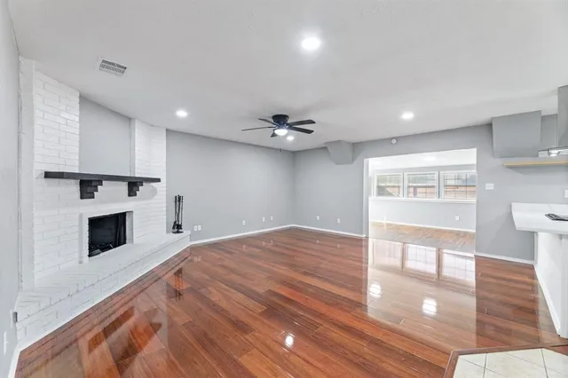 a large kitchen with kitchen island a sink stainless steel appliances and cabinets
