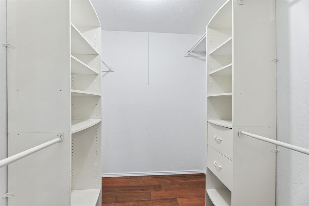 100 West Way Drive Allen, TX 75002 - Photo 16 of 31 PRIMARY Walk in closet with dark wood-type flooring