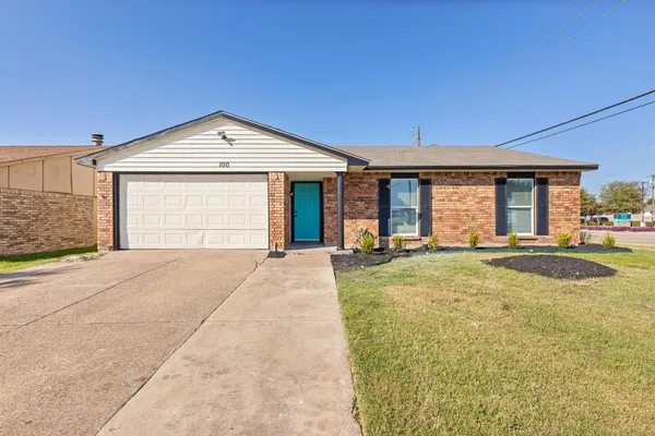 a view of a house with a yard and garage