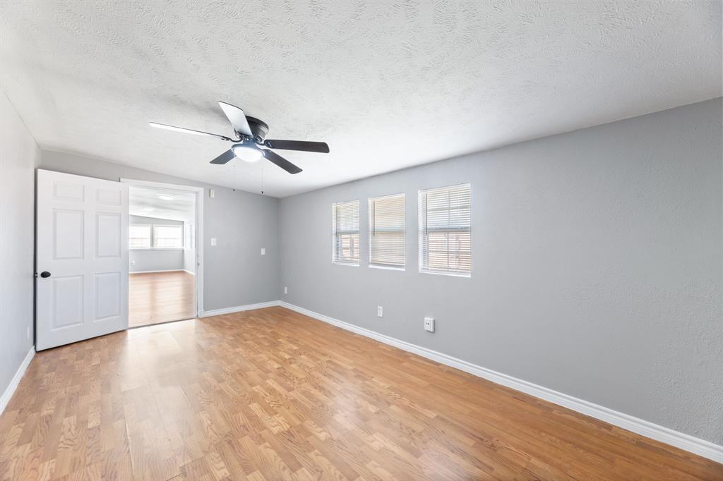 100 West Way Drive Allen, TX 75002 - Photo 19 of 31 PRIMARY OFFICE, OR PRIVATE LIVING, SITTING AREA. Light wood-type flooring, a textured ceiling, and a ceiling fan