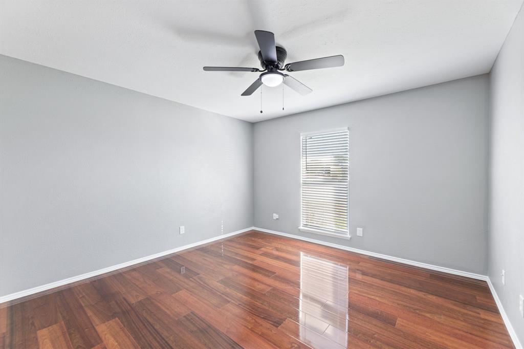 100 West Way Drive Allen, TX 75002 - Photo 25 of 31 Bedroom with wood finished floors and ceiling fan