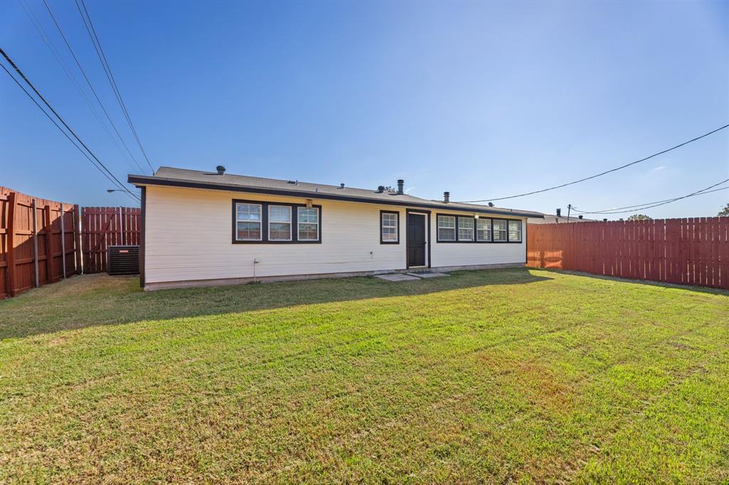 100 West Way Drive Allen, TX 75002 - Photo 26 of 31 Back of house featuring a fenced backyard and a patio