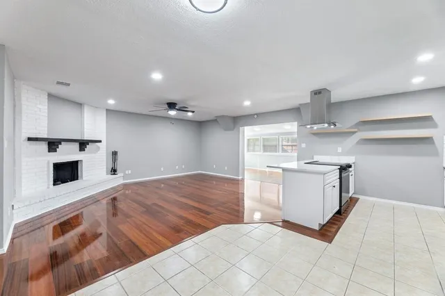 a view of backyard with wooden fence