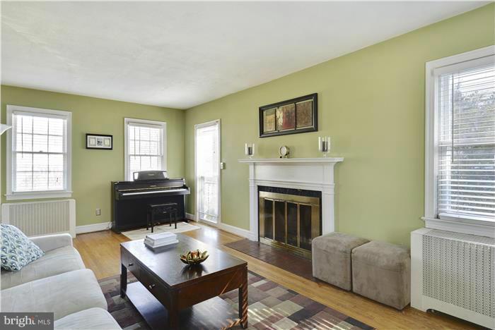 606 Forest Glen Road Silver Spring, MD 20901 - Photo 3 of 25 a living room with furniture and a fireplace