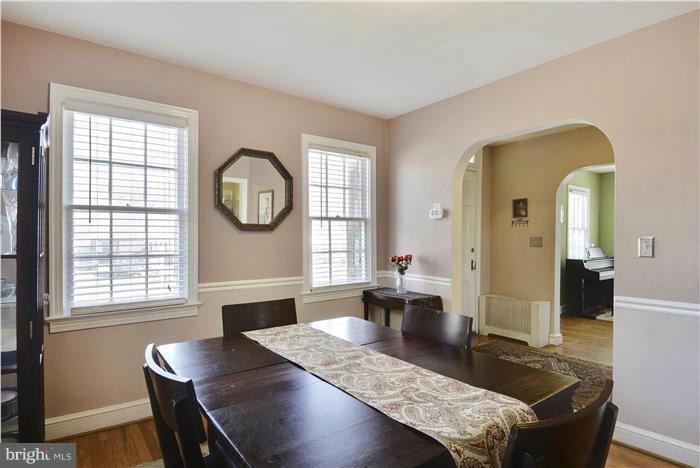 606 Forest Glen Road Silver Spring, MD 20901 - Photo 8 of 25 a living room with furniture and a large window