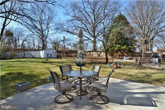 606 Forest Glen Road Silver Spring, MD 20901 - Photo 10 of 25 a view of a swimming pool with a table and chairs