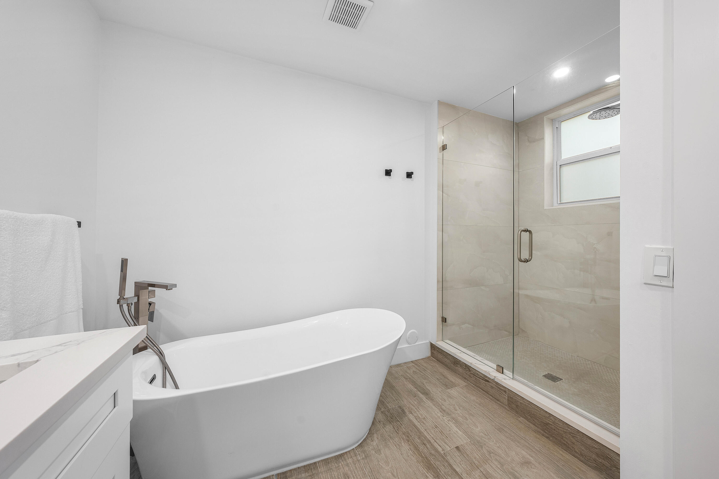 6229 Graycliff Drive, Unit A Boca Raton, FL 33496 - Photo 16 of 33 a bathroom with a bathtub and shower