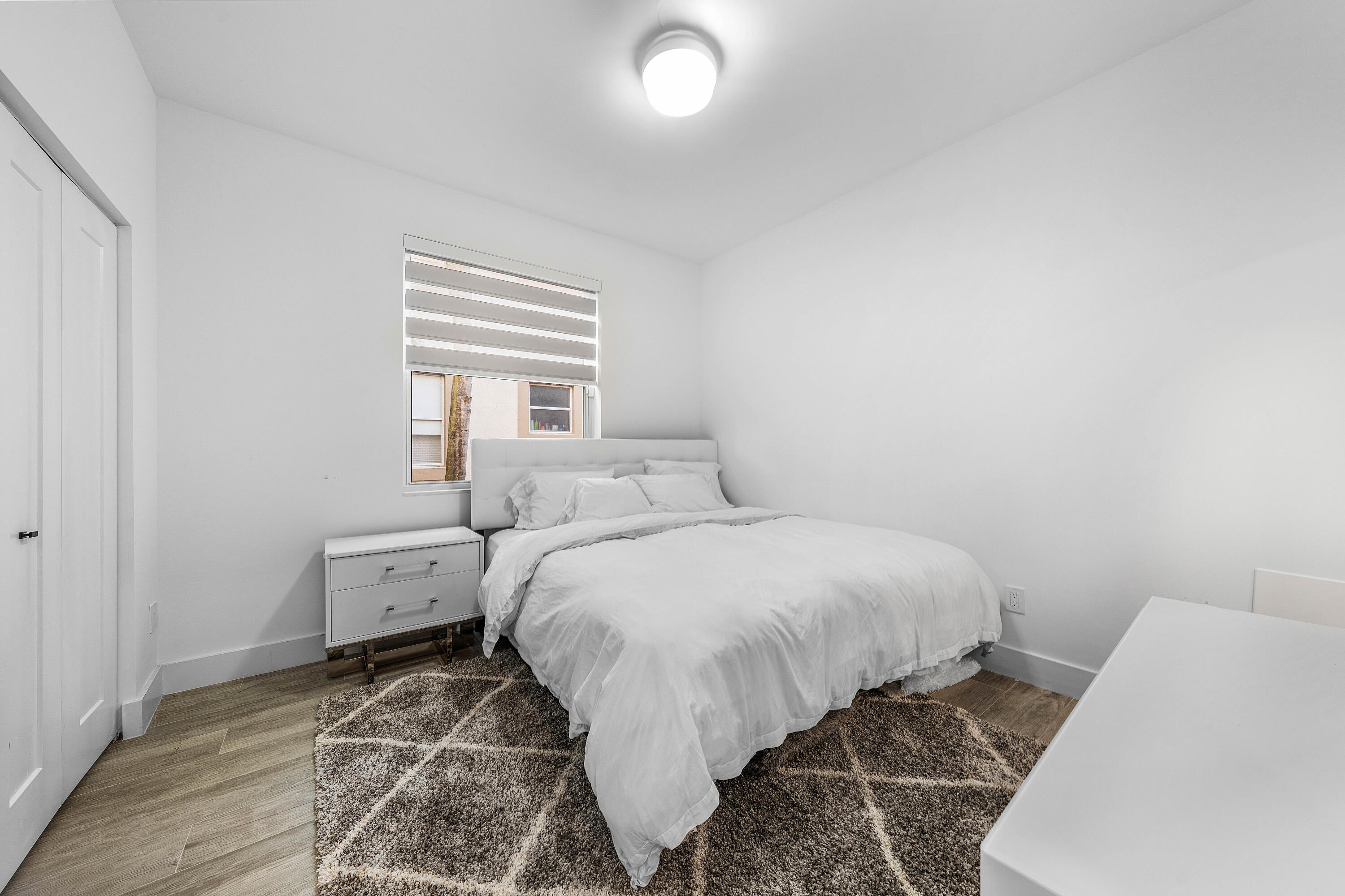 6229 Graycliff Drive, Unit A Boca Raton, FL 33496 - Photo 21 of 33 a bed room with a bed and a window