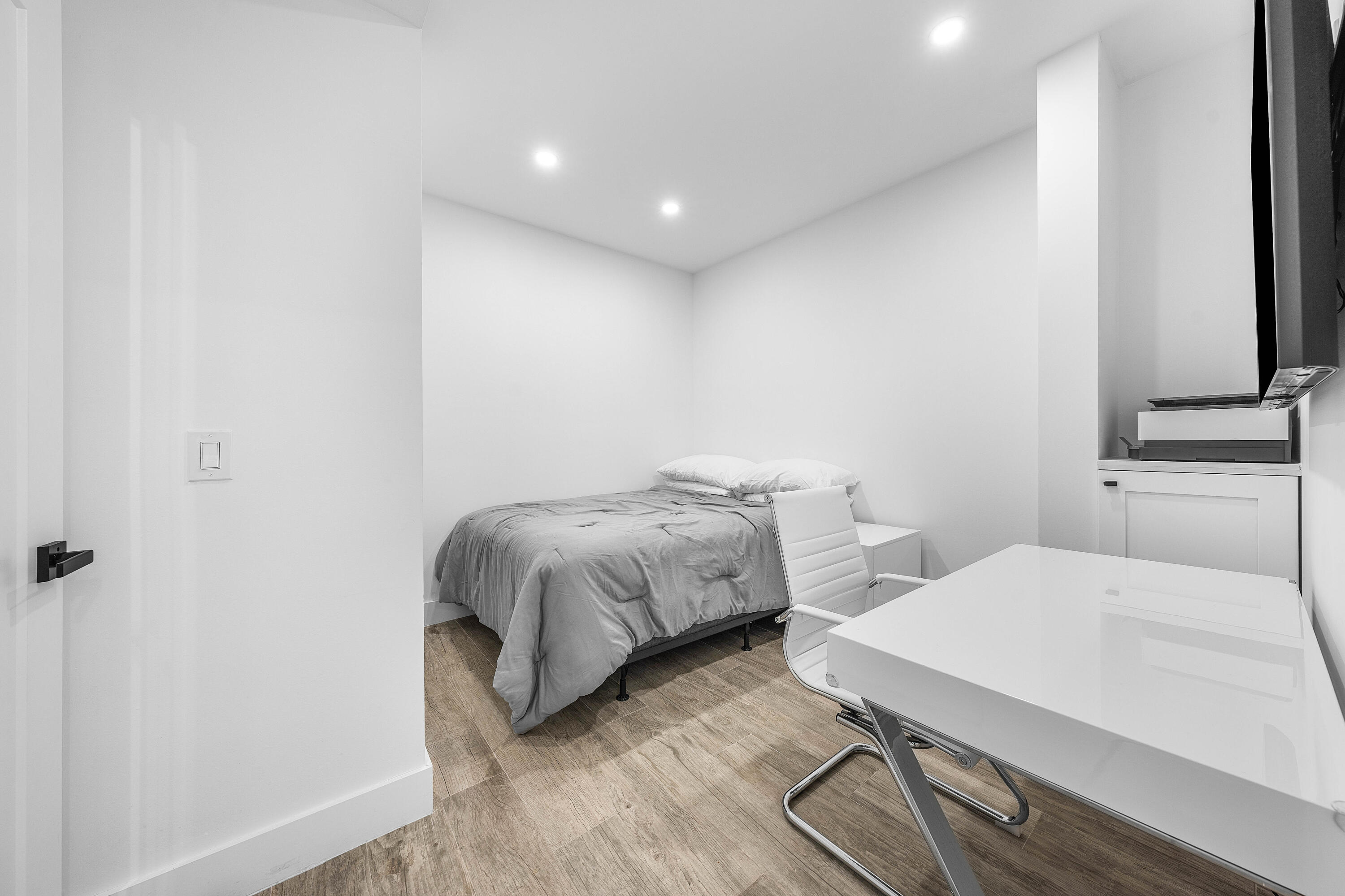 6229 Graycliff Drive, Unit A Boca Raton, FL 33496 - Photo 22 of 33 a bedroom with a bed and a table