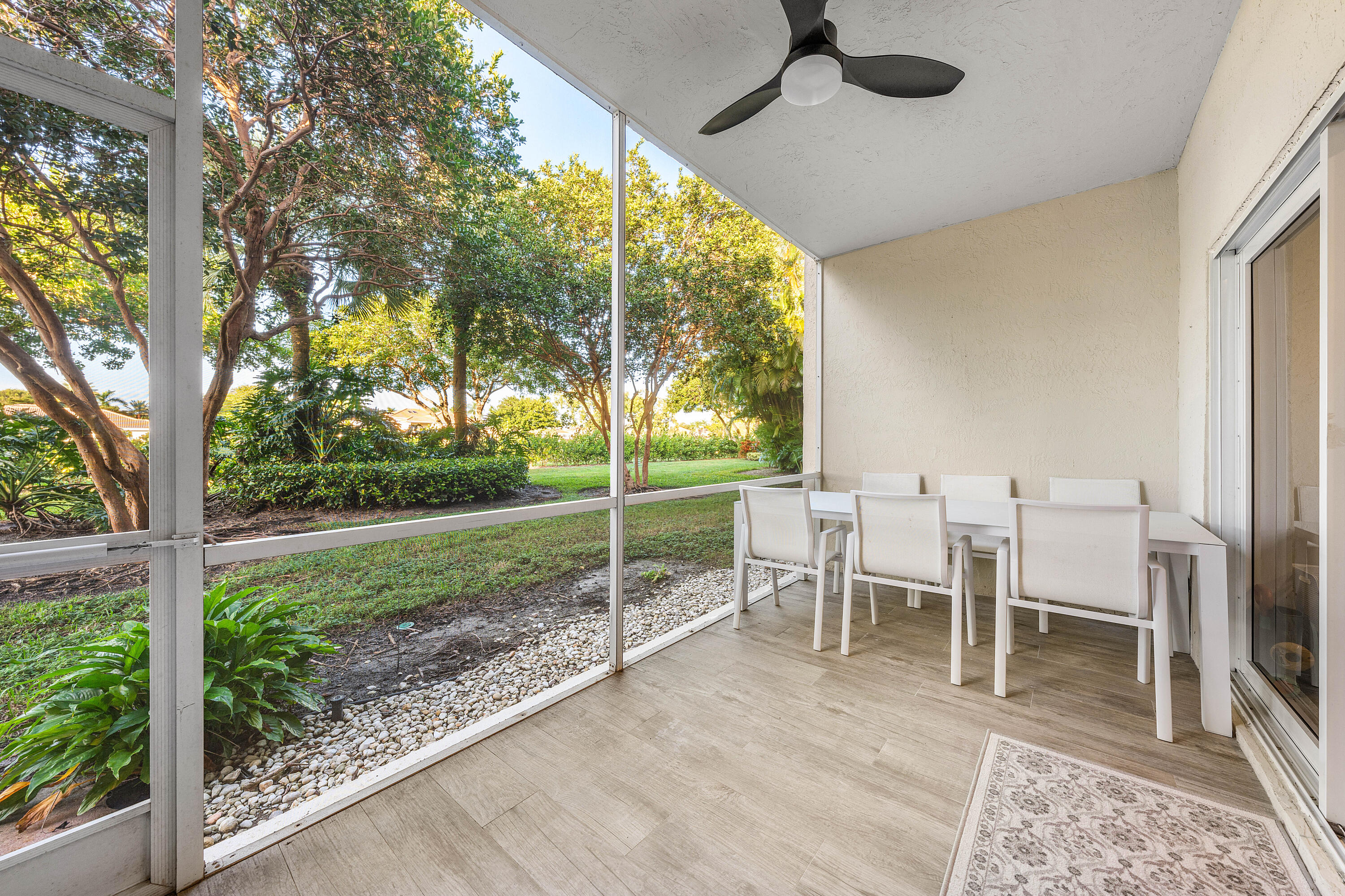 6229 Graycliff Drive, Unit A Boca Raton, FL 33496 - Photo 26 of 33 a view of a porch with chairs and backyard