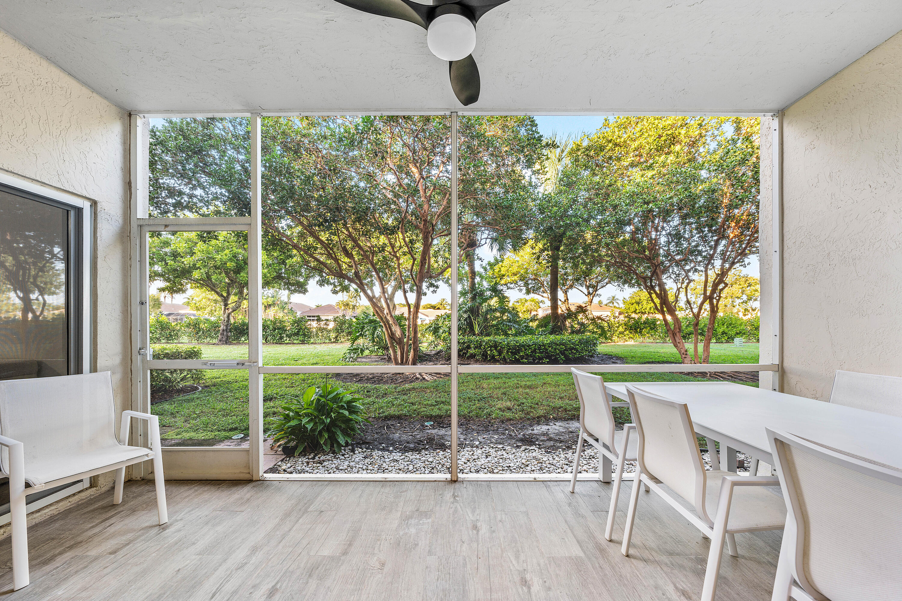 6229 Graycliff Drive, Unit A Boca Raton, FL 33496 - Photo 6 of 33 a view of a porch with furniture and garden