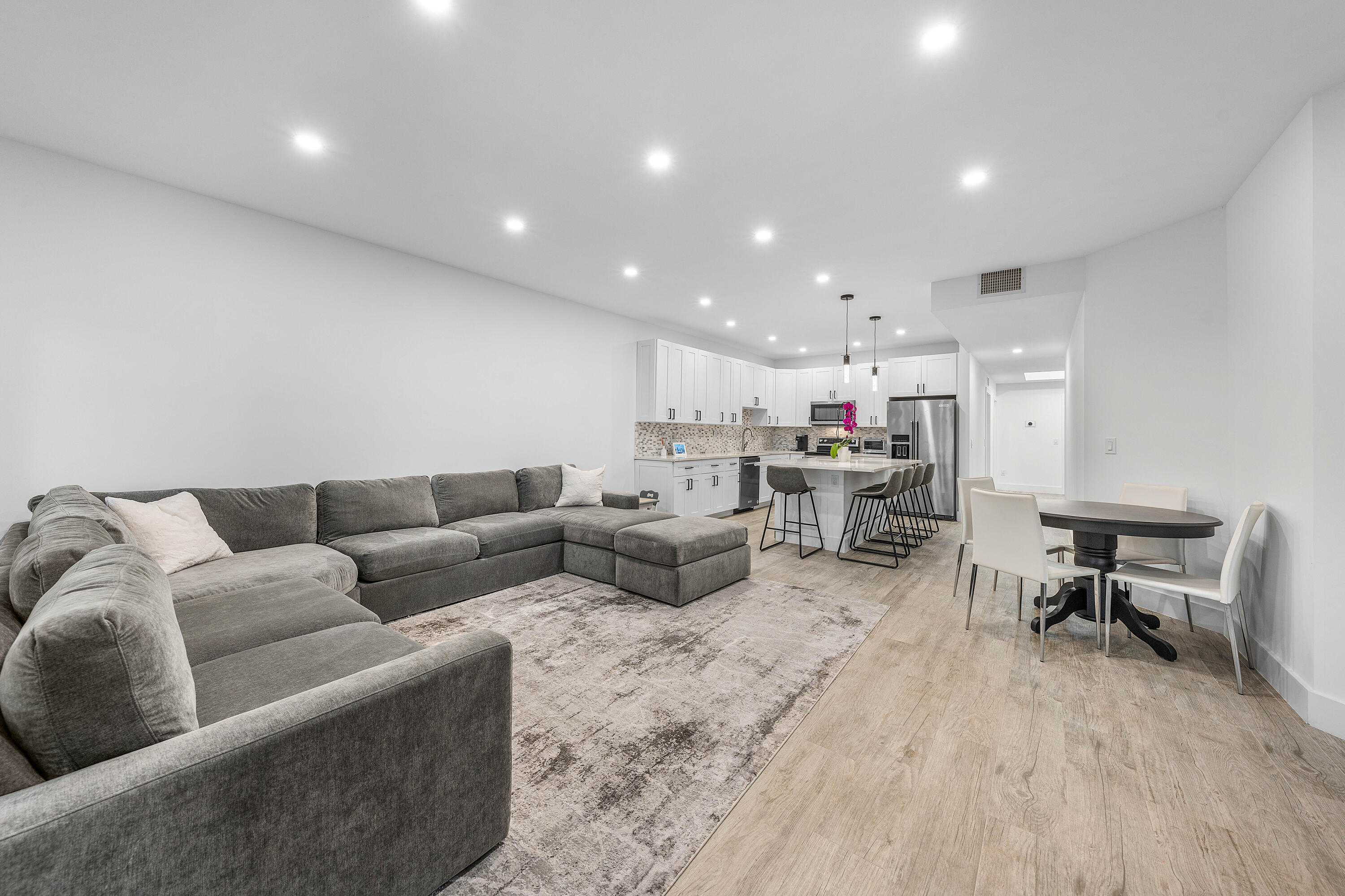 6229 Graycliff Drive, Unit A Boca Raton, FL 33496 - Photo 10 of 33 a living room with furniture and kitchen view