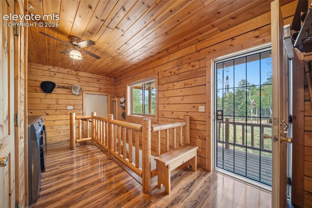 4269 Cedar Mountain Road Divide, CO 80814 - Photo 10 of 39 Main level entry with rustic log railing