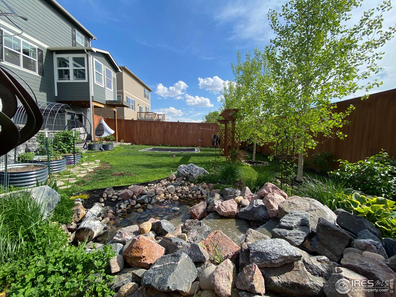 4403 Garnet Way Longmont, CO 80504 - Photo 9 of 20 Water feature and beautiful landscaping