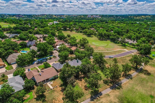 an aerial view of a house with a garden