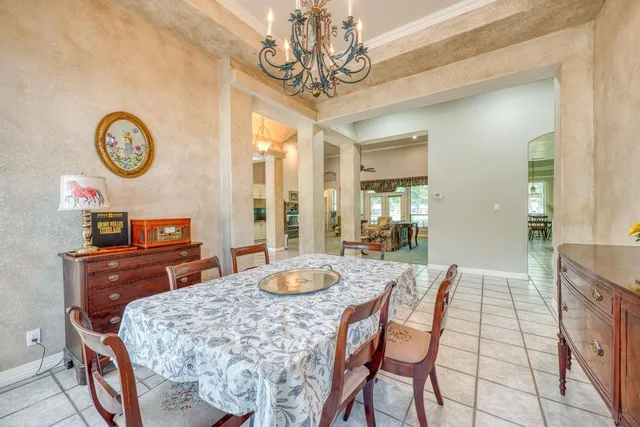 a dining room with a table and chairs