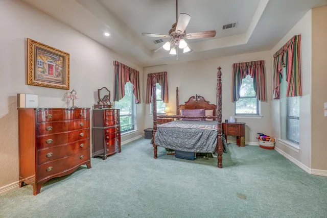 a bedroom with bed and window