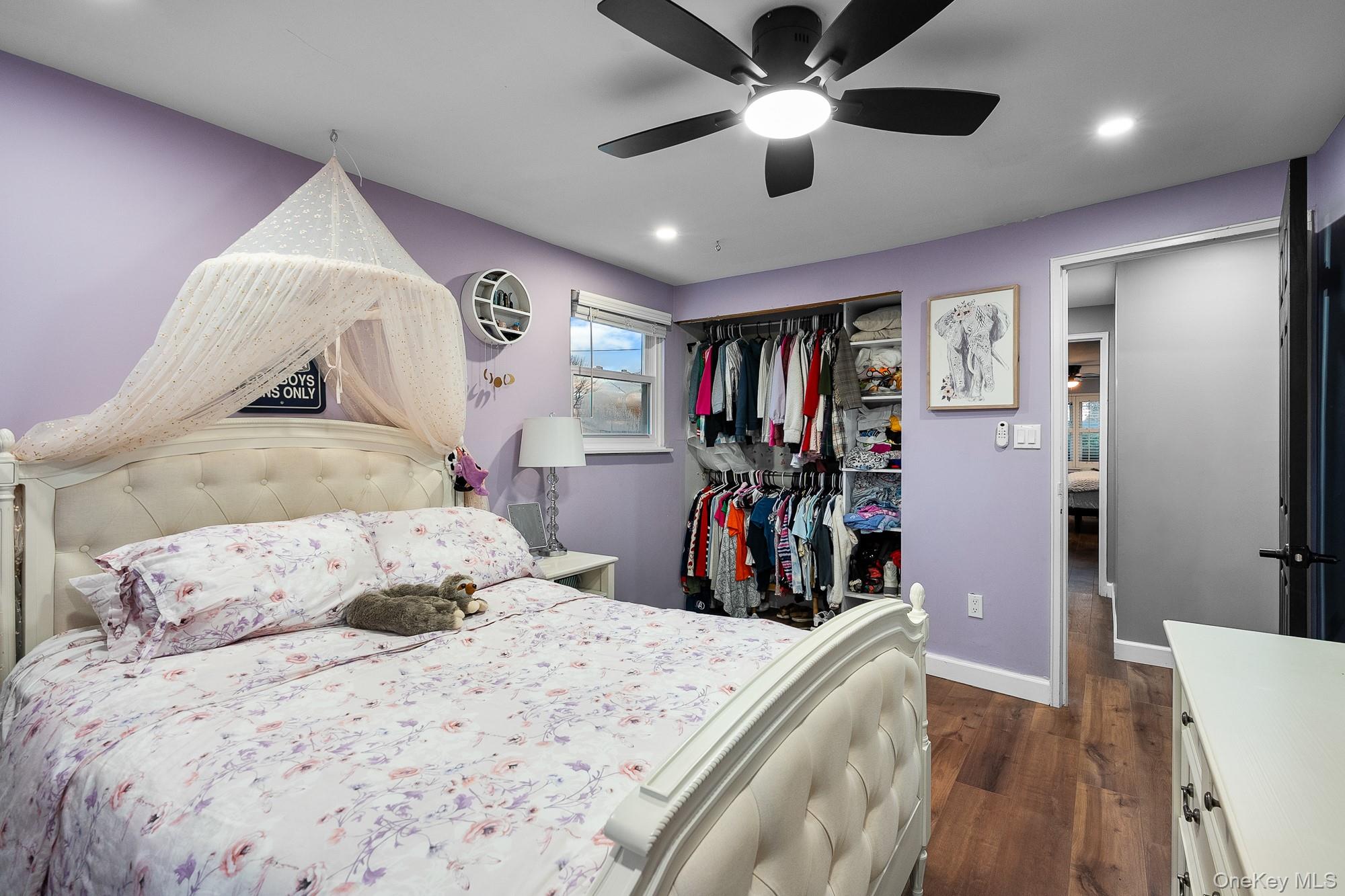 19 Corvette Road Selden, NY 11784 - Photo 19 of 28 Bedroom with dark wood-style floors, ceiling fan, recessed lighting, and a closet