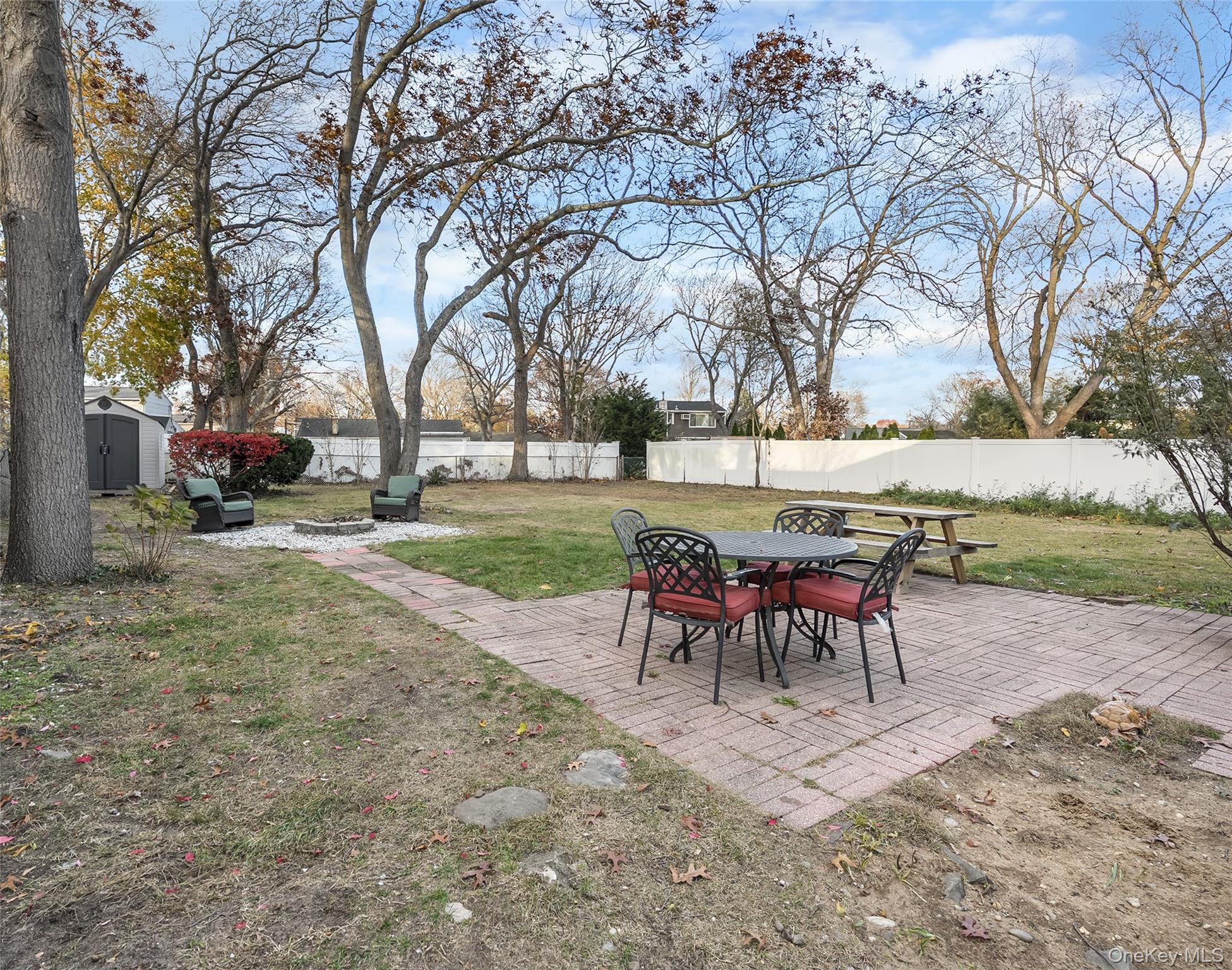19 Corvette Road Selden, NY 11784 - Photo 25 of 28 Fenced backyard with a patio area and a shed