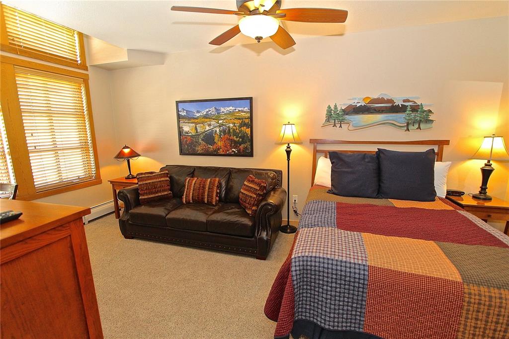 910 Copper Road, Unit 623 Copper Mountain, CO 80443 - Photo 17 of 24 a bedroom with furniture and a window