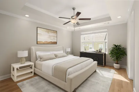 a bedroom with a large bed and a chandelier