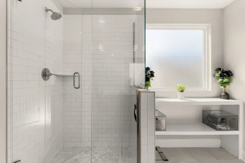 a white bath tub sitting next to a white sink