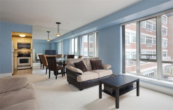 197 8th Street, Unit 501 Boston, MA 02129 - Photo 5 of 9 a living room with furniture and a large window