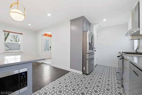 a kitchen with a sink and a stove