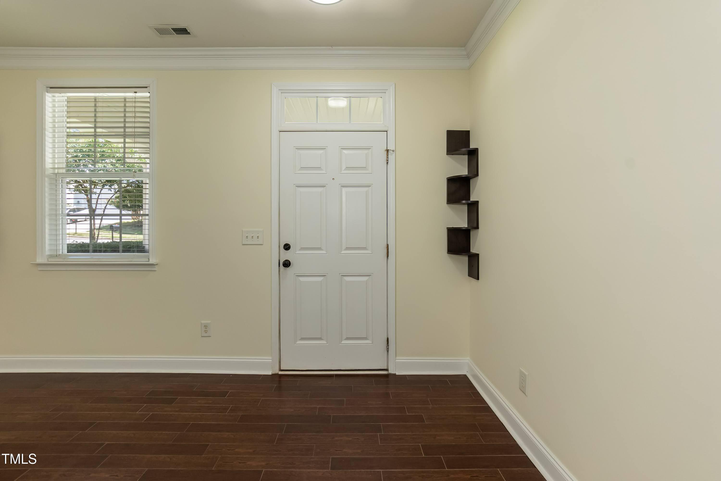 418 Byrams Ford Drive Cary, NC 27513 - Photo 8 of 53 an empty room with wooden floor and closet