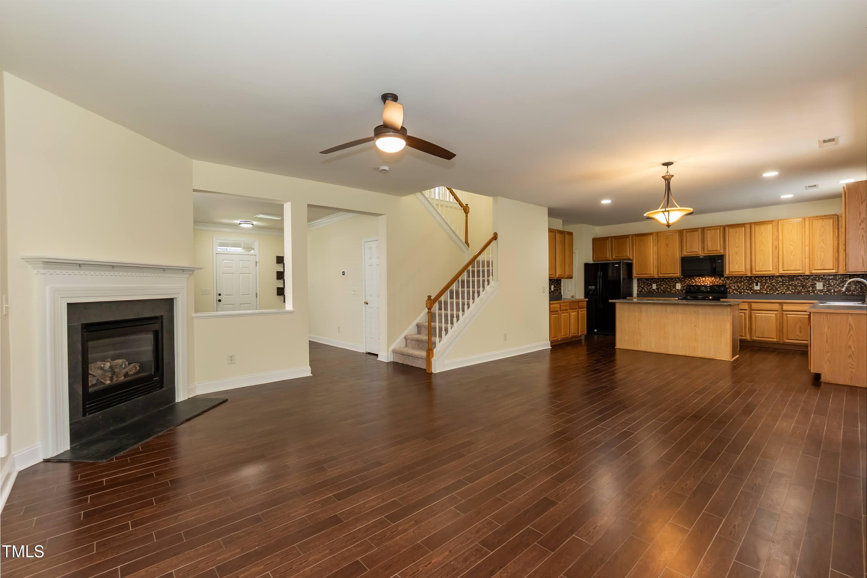 418 Byrams Ford Drive Cary, NC 27513 - Photo 12 of 53 a view of a kitchen with furniture and wooden floor