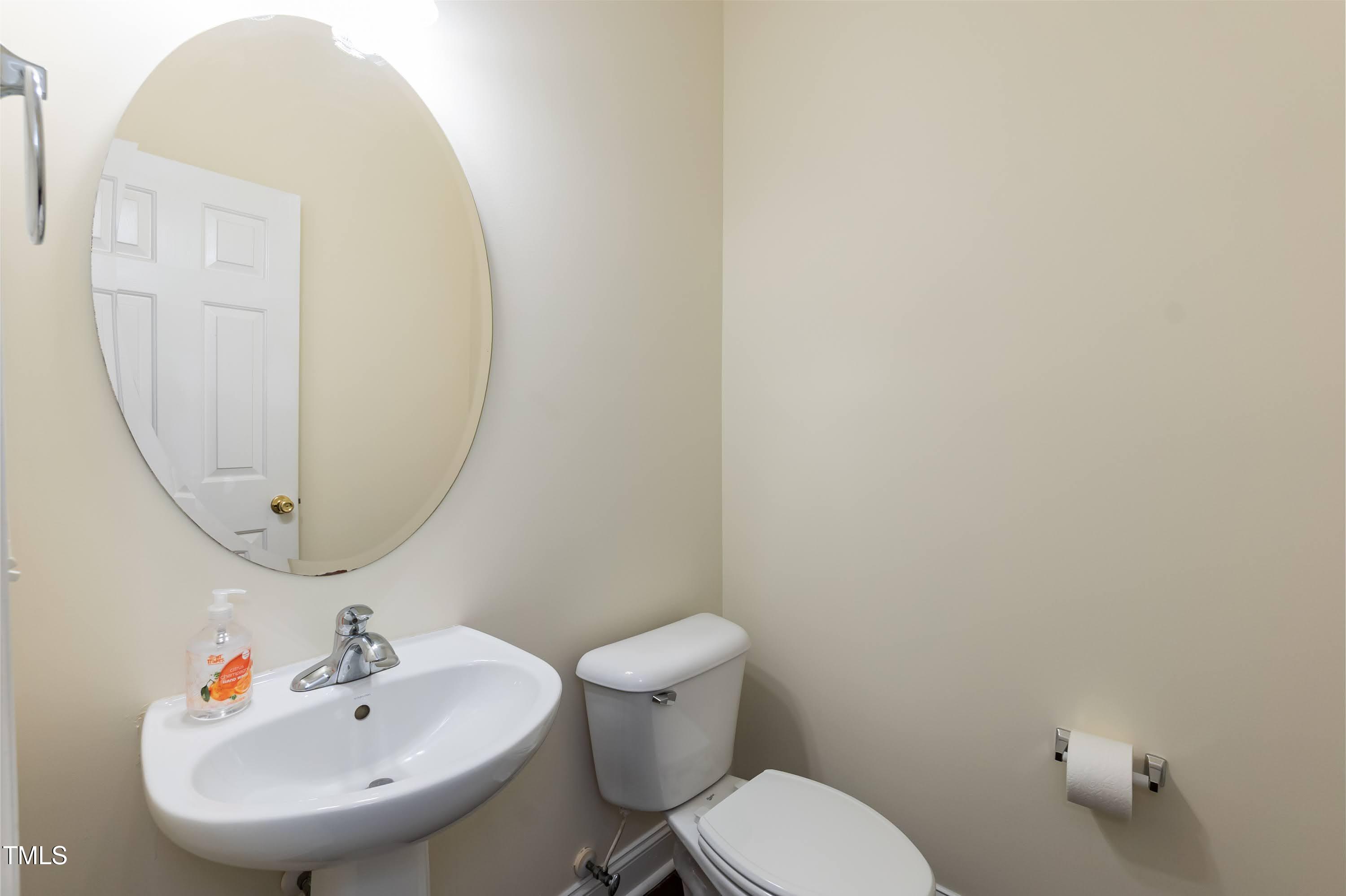 418 Byrams Ford Drive Cary, NC 27513 - Photo 19 of 53 a bathroom with a sink and a mirror