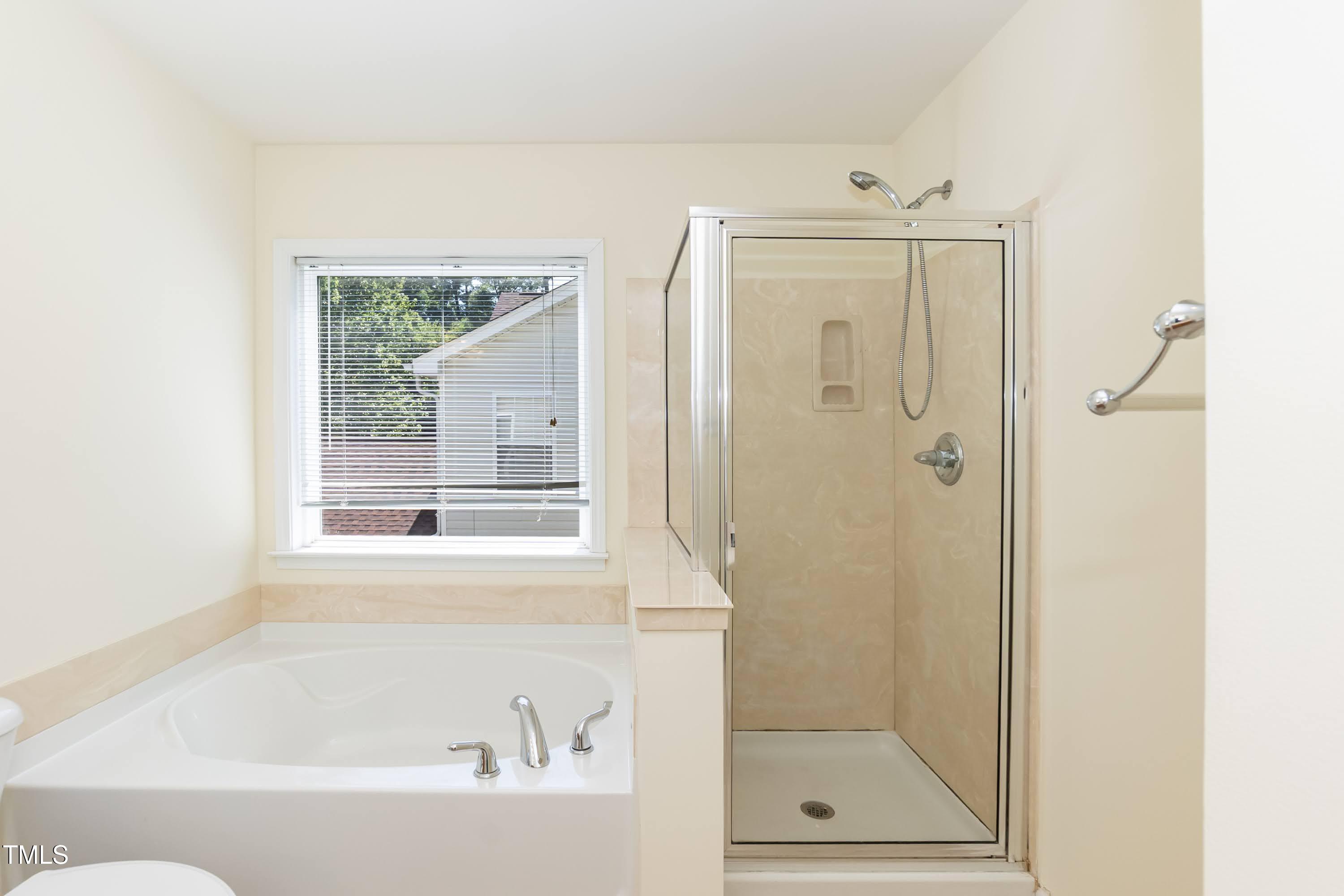 418 Byrams Ford Drive Cary, NC 27513 - Photo 26 of 53 a bathroom with a bathtub
