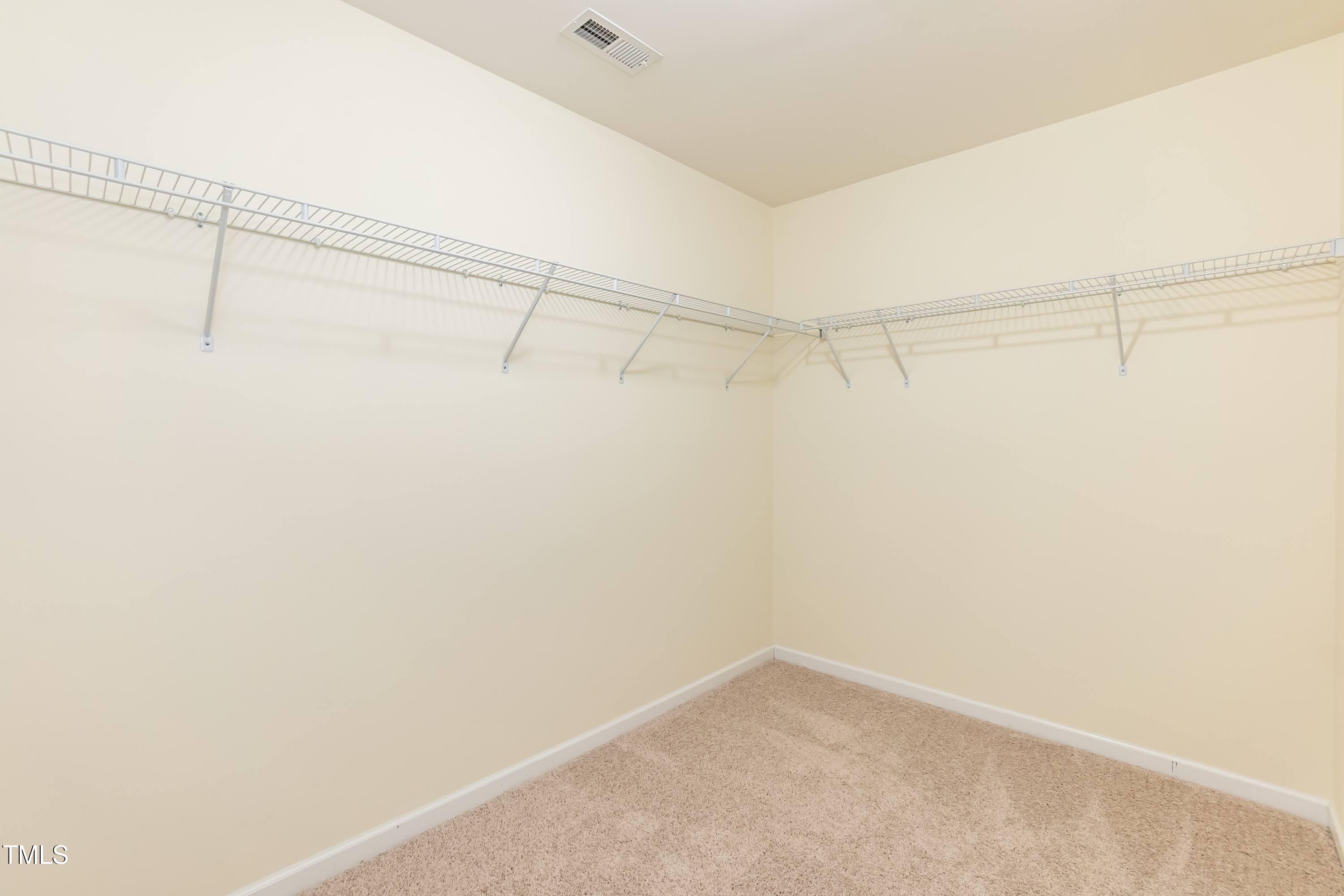 418 Byrams Ford Drive Cary, NC 27513 - Photo 27 of 53 a view of a room with racks on the wall